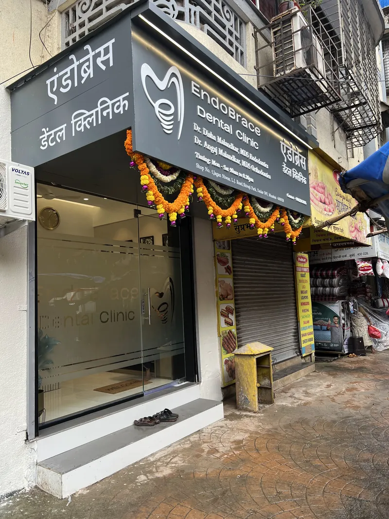 The clinic entrance on Lady Jamshedji Road, with its signboard in Marathi and English